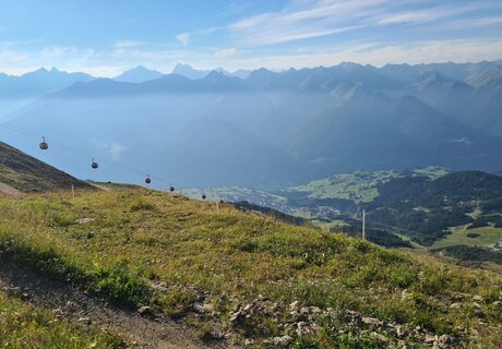Stunning mountain landscape with cable cars in the foreground.